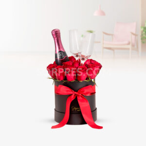 Caja de rosas con copas y riccadonna. Especial para celebrar momentos increíbles, aniversarios, cumpleaños y más.